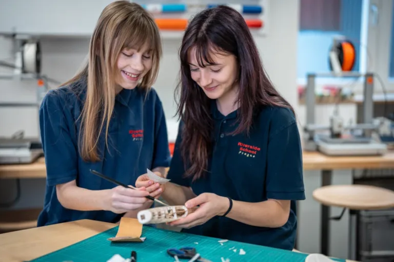 Two students building a model together in the Riverside Innovation Centre